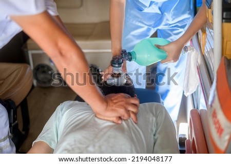 Group of rescue emergency team transporting patient from Emergency car  through Hospital Corridors. cardio pulmonary resuscitation on an unconscious patient . Royalty-Free Stock Photo #2194048177