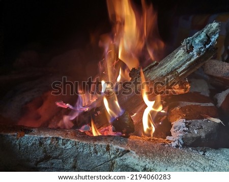 beautiful big bonfire among the rocks at night. High quality photo