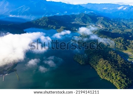 Sun Moon Lake in Nantou, Taiwan, the clouds and mist are misty at sunrise. Using drone aerial photography, you can enjoy the beautiful sunrise of the entire lake
