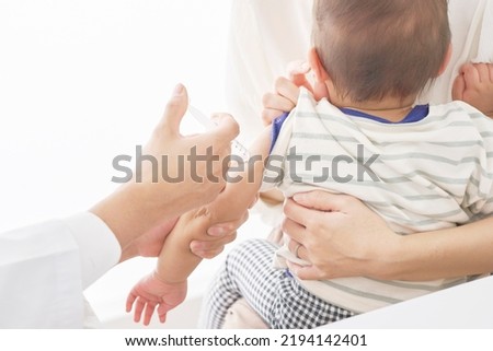 Asian baby being injected at the examining room Royalty-Free Stock Photo #2194142401