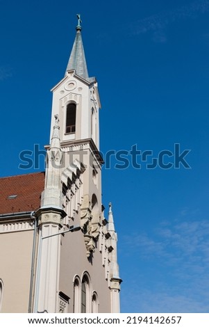 Picture of a roman catholic church and the bell tower in Hungary