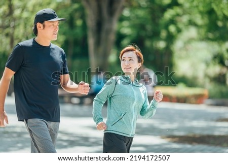 
Men and women doing walking and aerobic exercise
