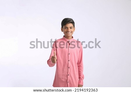 Indian college boy giving expression on white background.