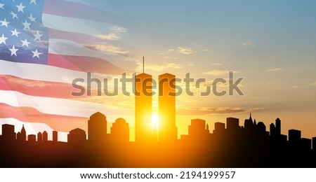 New York skyline silhouette with Twin Towers and USA flag at sunset. 09.11.2001 American Patriot Day banner. NYC World Trade Center. Royalty-Free Stock Photo #2194199957