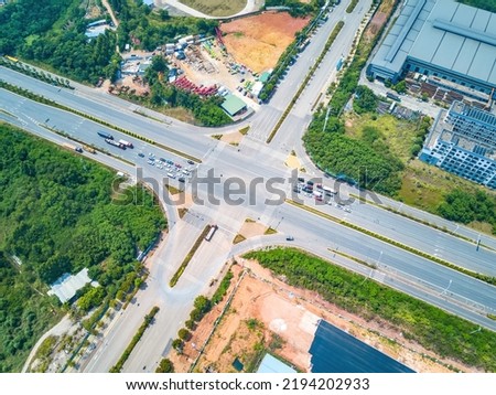 Aerial shot of road intersection in urban industrial area