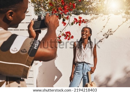 Photographer, portrait and happy model woman in summer clothes for a creative fashion shoot outdoors. Influencer, freelancer and entrepreneur in professional photography taking social media content