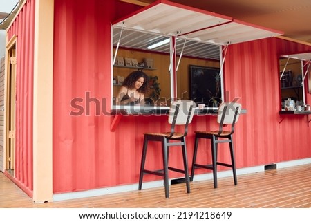 Small business and startup of a woman entrepreneur owner of a new home restaurant or fast food store. Serious female chef or manager with a mindset for growth, vision and success for pop up company. Royalty-Free Stock Photo #2194218649