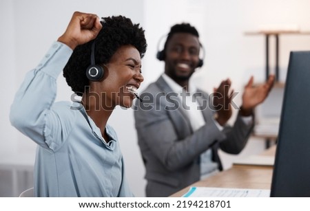 Celebrating, cheering and success with a female call center agent or support staff employee working in service or sales. Helping, assisting and talking to solve problems and provide feedback Royalty-Free Stock Photo #2194218701