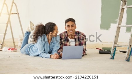 Couple relax with laptop, living room home renovation and interior design ideas online internet. Happy man and woman decorate apartment house together, love relaxing on floor after moving to Royalty-Free Stock Photo #2194220151