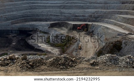 Panoramic aerial view of coal mine. Open pit mine industry, big yellow mining truck for coal quarry. Open coal mining anthracite mining. Pit on coal mining by open way.  Royalty-Free Stock Photo #2194232995