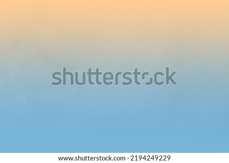 Soft pastel blue gradation with plain yellow light orange tone color on blank cardboard box recycled paper texture minimal peaceful background concept