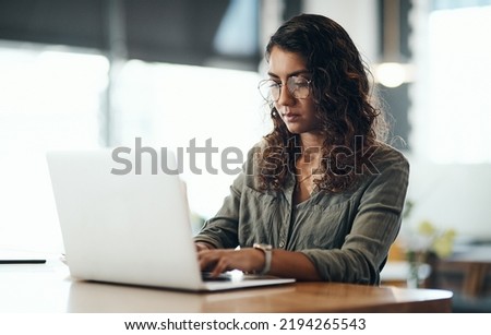 Business owner typing on laptop, checking emails and ordering new stock while sitting at a restaurant. Cafe manager, boss and entrepreneur networking online, updating social media page and website Royalty-Free Stock Photo #2194265543