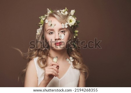 Beautiful woman with light hair and butterflys