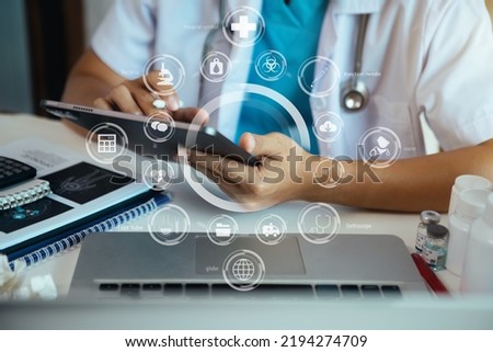 Doctor work on digital tablet healthcare doctor technology tablet using computer in a modern office. Royalty-Free Stock Photo #2194274709