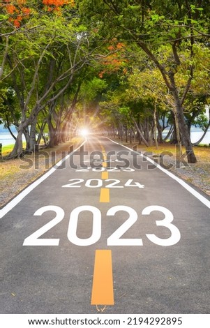 Five years from 2023 to 2027 on asphalt road surface. Beginning business startup to success concept and challenge investment idea Royalty-Free Stock Photo #2194292895