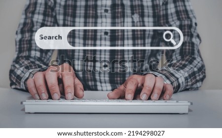 Man hands are using a computer keyboard to Searching for information.data Search Technology Search Engine Optimization.