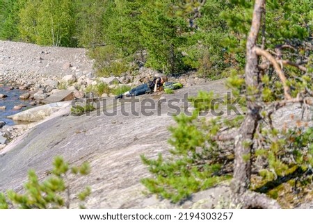 The girl photographer will take pictures of nature. Beautiful natural background.