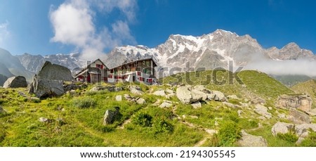 The Monte Rosa and Punta Gnifetti paks over the Rifugio Zambon Zappa chalet  - Valle Anzasca valley. Royalty-Free Stock Photo #2194305545