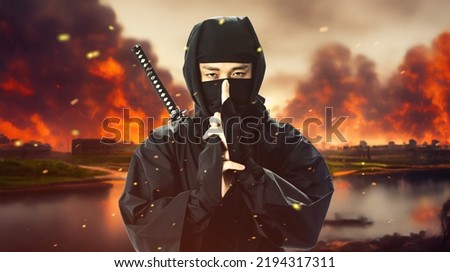 A ninja and a burning castle. The concept of a Japanese period drama. The Sengoku period. Royalty-Free Stock Photo #2194317311