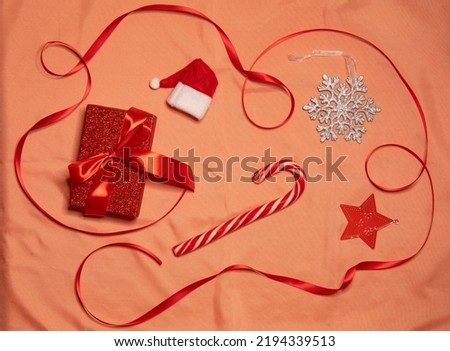 Flat lay composition of christmas decoration on pink background.