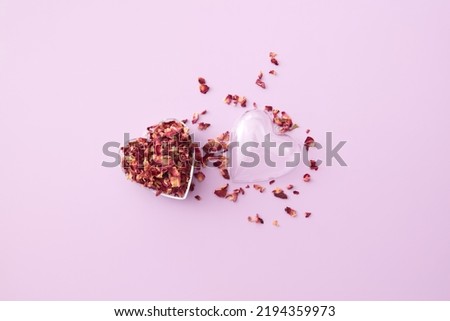 Heart-shaped pendant full of rose petals.
