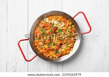 Menemen, Turkish breakfast, eggs with peppers and tomatoes, top view Royalty-Free Stock Photo #2194363979