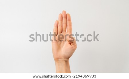 Sign language of the deaf and dumb people, English letter b, open hand with thumb pressed