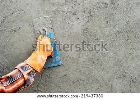 Workers were plastering. Royalty-Free Stock Photo #219437380