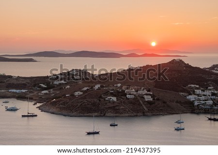 Sunset in the Mediterranean - Greek islands with small villages and yachts near the shore. Mykonos.