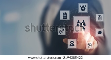 Recruitment and HRM concept.  Job search, headhunting and recruitment process. Touching on recruiting icon with education, qualification, cv, resume, skills and experience on smart screen background. Royalty-Free Stock Photo #2194385423