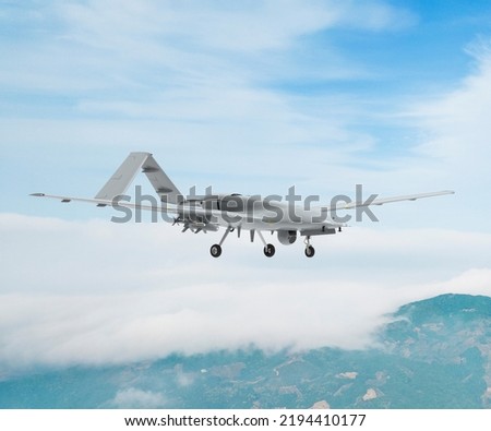 Bayraktar TB2 Unmanned aerial vehicle gliding through the clouds. Bayraktar TB2 combat drone in flight over the clouds. Royalty-Free Stock Photo #2194410177