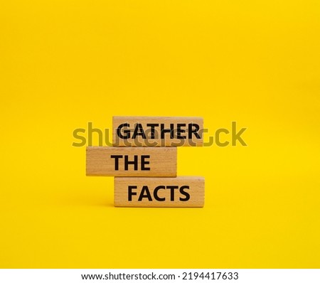 Gather the facts symbol. Wooden blocks with words Gather the facts. Beautiful yellow background. Business and Gather the facts concept. Copy space.