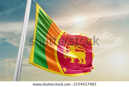  Sri Lanka national flag waving in beautiful clouds.