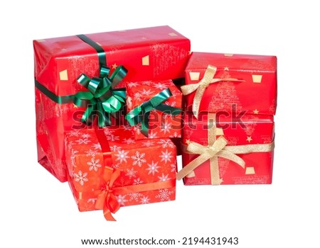 a set of gifts in red paper with green and gold bows, isolated on a white background, Christmas, New Year. High quality photo