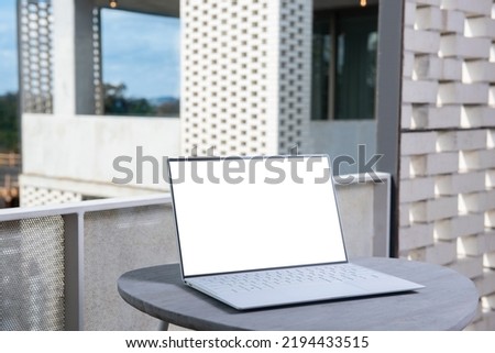 Mockup image of laptop with blank white screen with modern background