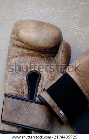 Old retro boxing gloves. Sport equipment