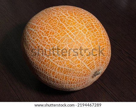 beautiful yellow melon lies on a wooden table