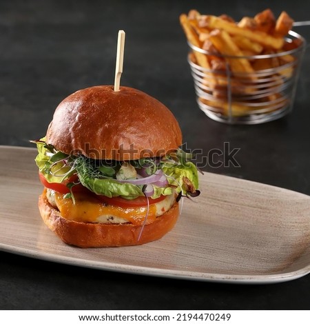 A plate of delicious beef burger With fried potato chips