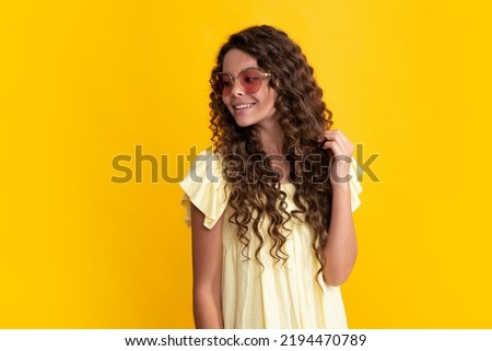 Happy teenager, positive and smiling emotions of teen girl. Headshot portrait of teenager child girl isolated on studio background. Childhood lifestyle concept. Mock up copy space.