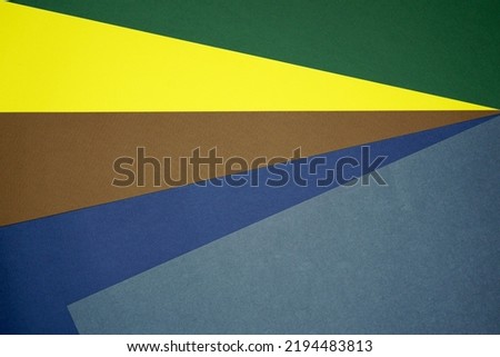 Brown, yellow, green, blue five tone color paper background with stripes. Abstract background modern hipster futuristic. Texture design
