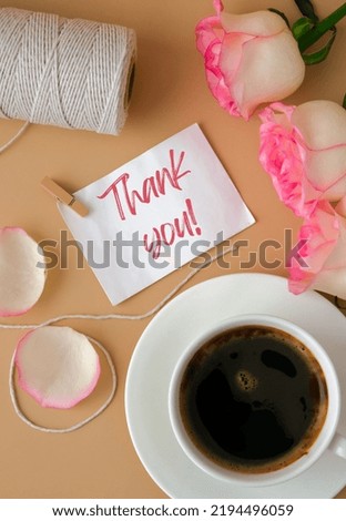 THANK YOU text Tender pink rose with white cup of coffee on beige background. Romantic pastel pink rose flower. Neutral earth tones. Holiday morning breakfast Creative Greeting card
