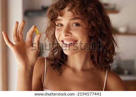 Diet. Nutrition. Healthy Eating, Lifestyle. Close Up Of Happy Smiling Woman Taking Pill With Cod Liver Oil Omega-3 In Morning. Vitamin D, E, A Fish Oil Capsules  Royalty-Free Stock Photo #2194577441