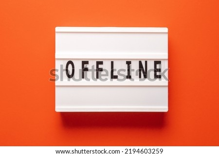 Offline - means that the device and its user are disconnected from the global internet, text concept on lightbox