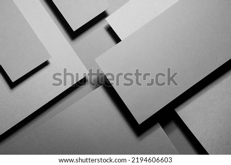 Grey carbon abstract geometric background with soar rectangle surfaces with corners, stripes in hard light, black shadows - monochrome style backdrop in elegant simple modern minimal style, top view. Royalty-Free Stock Photo #2194606603