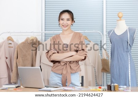 Professional designer sits at her desk thinking about fashion design ideas in her studio, Fashion designer, Creativity and ideas, Mannequin, Shirt sketch, Color scheme, Garment accessories.