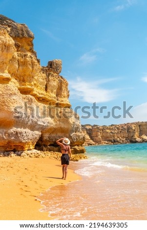 Strolling in summer on vacation on the beach at Praia da Coelha, Algarve, Albufeira. Portugal Royalty-Free Stock Photo #2194639305