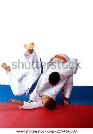 Throw of Judo made sportsman  with orange belt Royalty-Free Stock Photo #219466309