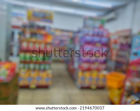 Blurred abstract image various kinds of goods on the shelves inside minimarket or Bokeh image Typical Indonesia retail store