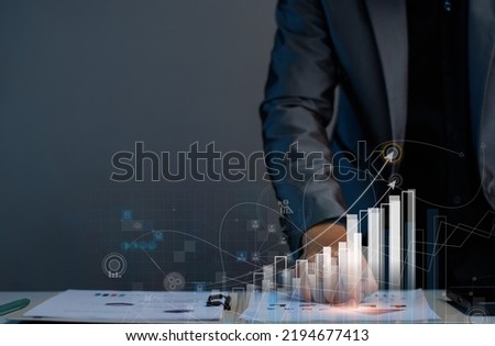 Business success concept. Businessman analyze stock market, study future marketing strategies, set goals for success, business planning, long-term investment planning, online stock trading. Royalty-Free Stock Photo #2194677413