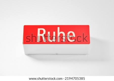 Quiet sign - word Ruhe. sign light box. angle view of icon information lamp, light with the text Ruhe. geman language word - RUHE - Quiet - Wall sign over a entry of a meetingroom